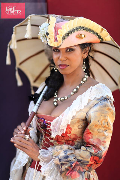 Caribbean Pearl in Day Lady Gown with a parasol