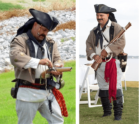 Damon Tobin loading a gun and holding a gun